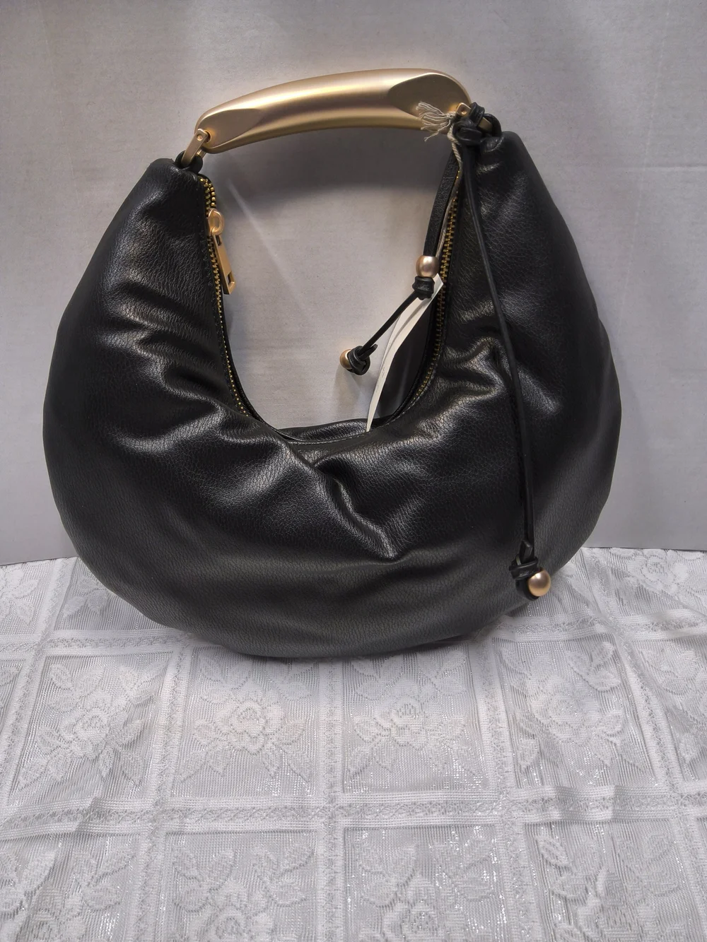 A New Day Crescent Handle Bag in Black with Gold Accent
